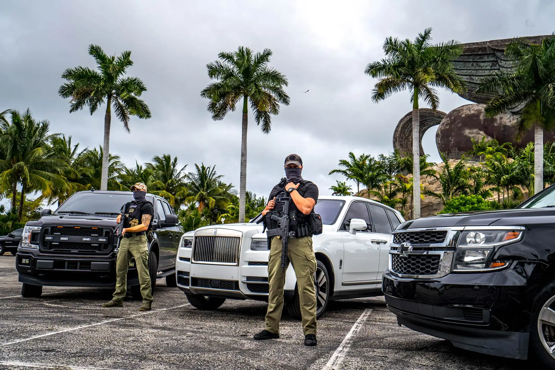 FSO Guard armed security officers with client vehicles in Miami