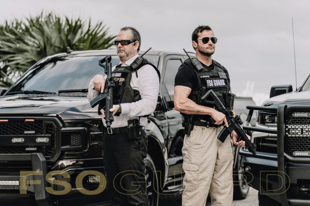 FSO Guard private security officers at a client vehicle in Miami FSO Guard private security officers at a client vehicle in Miami